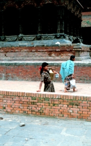 Nepal - Girl with Urn at Temple