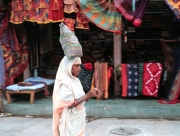 India - Woman Carrying Bag on Her Head