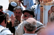Man in Talit and Torah at Wall on Shabbat